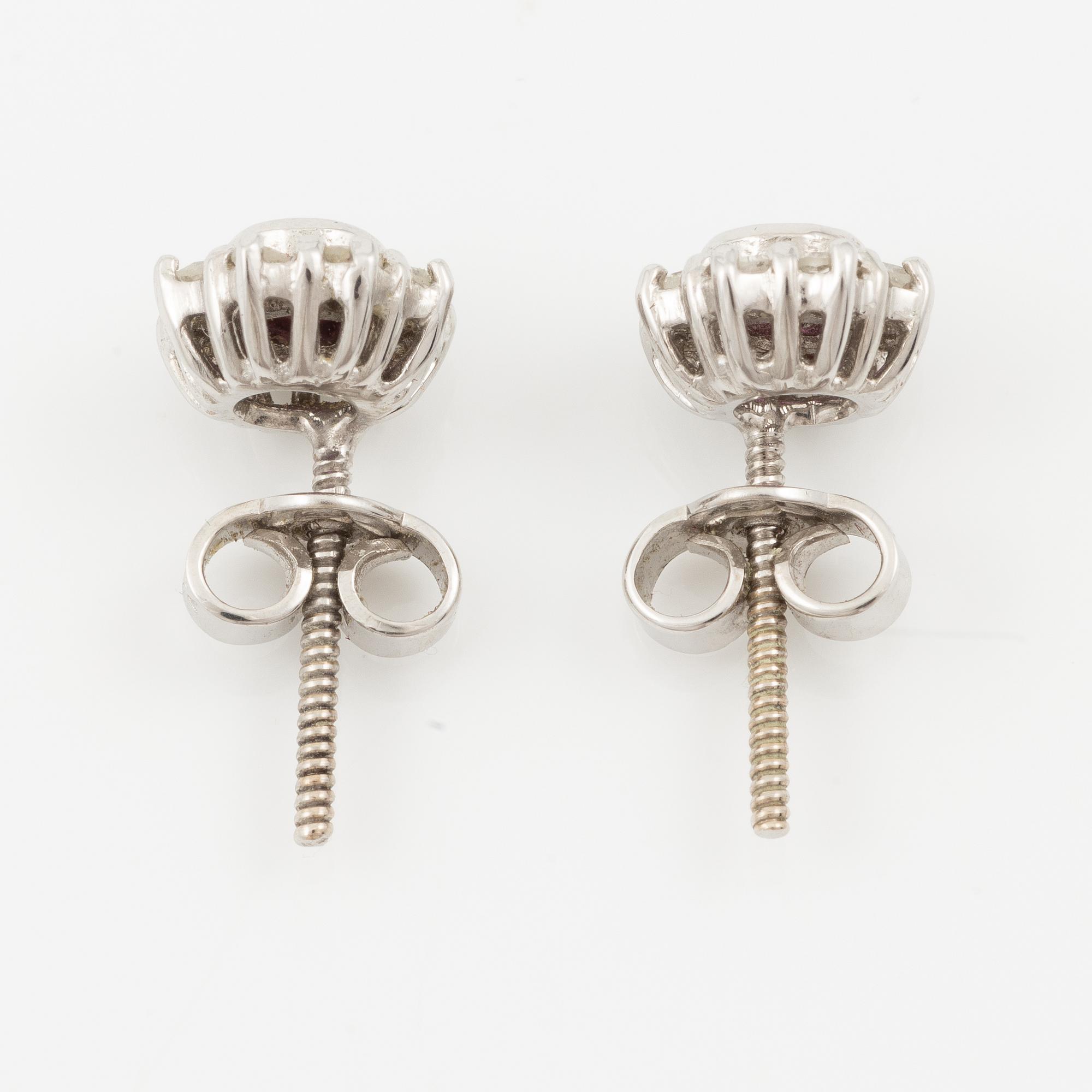 Pendant with gold chain, 
Pendant with white gold chain, 
Earrings a pair, rubies with brilliant-cut diamonds.