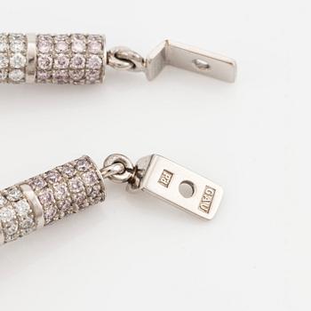 A pair of 18K white gold Gaudy earrings with two princess-cut diamonds accompanied by three sets of pendants.