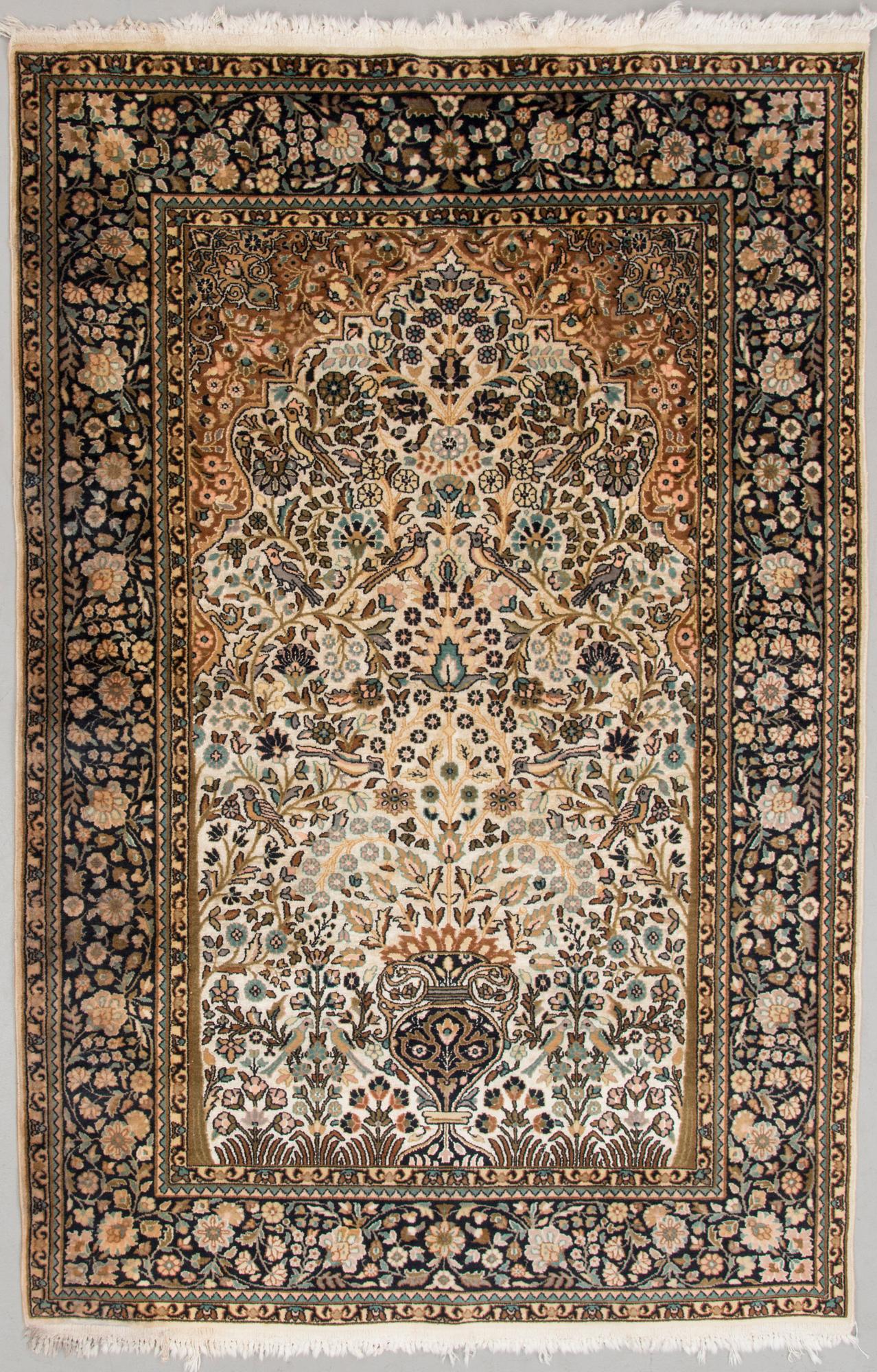 A Kashmir carpet, silk on cotton warp. Circa 185 x 125 cm.