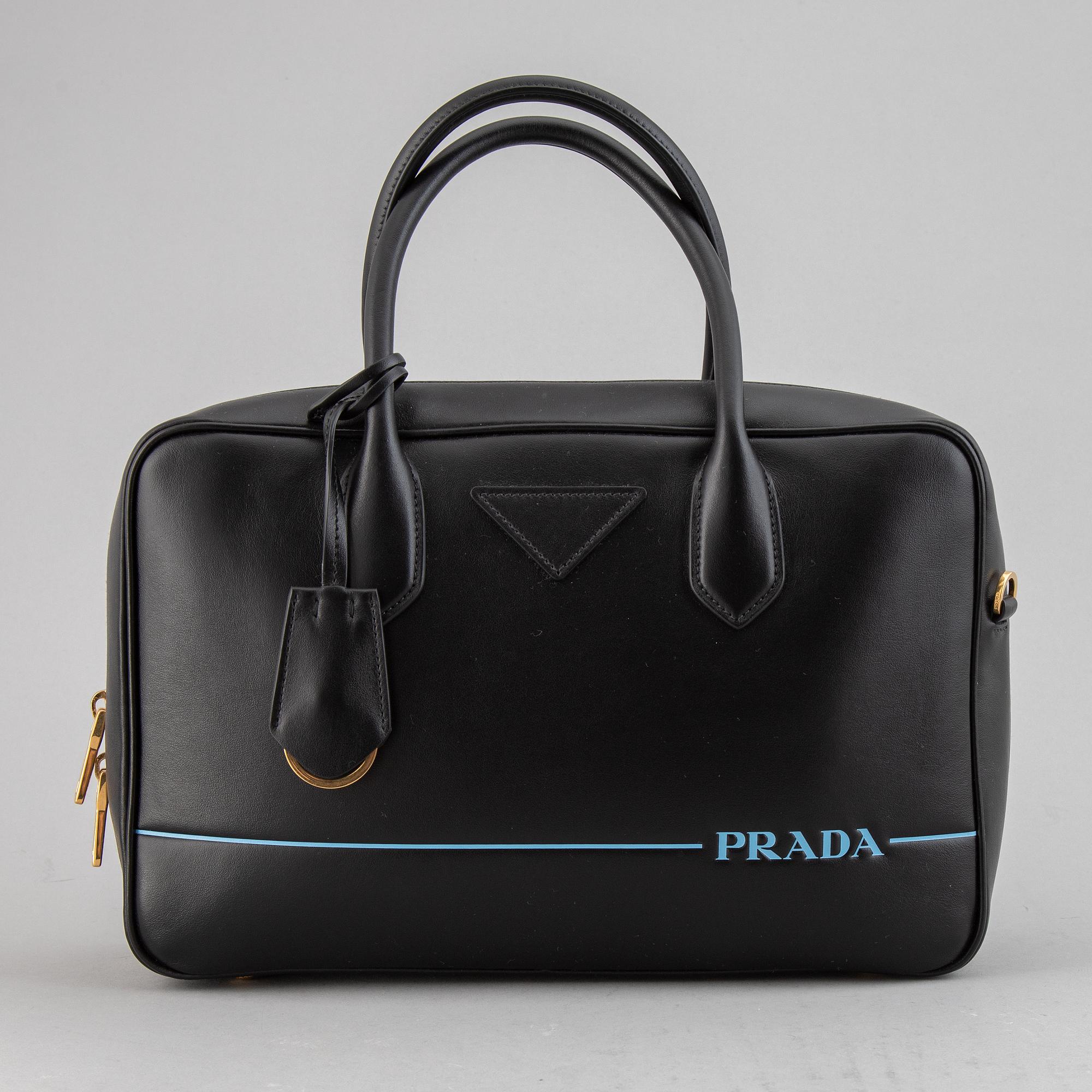 PRADA, a leather bag.