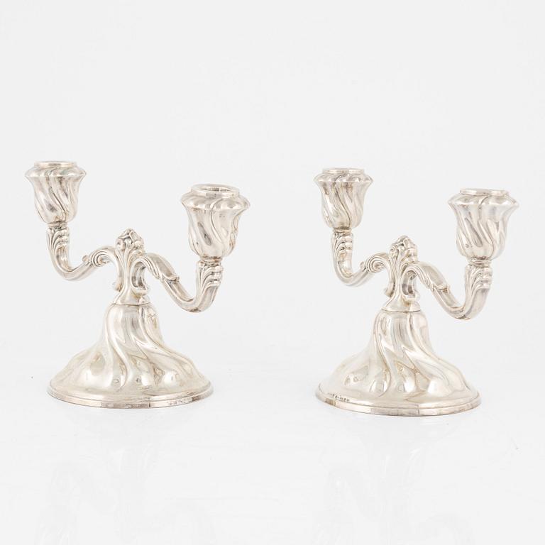 A pair of silver candelabras, first half of the 20th Century.