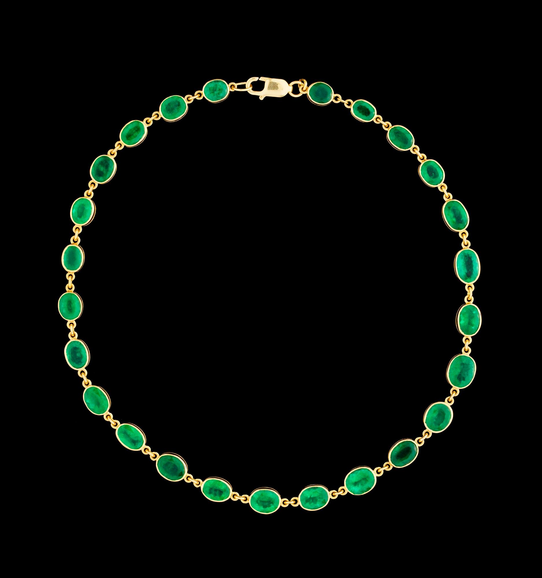 A gold and emerald necklace.