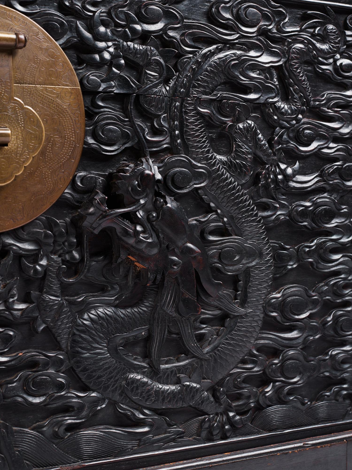 A massive 'five clawed dragon' hardwood storage chest, Qing dynasty, 19th century.