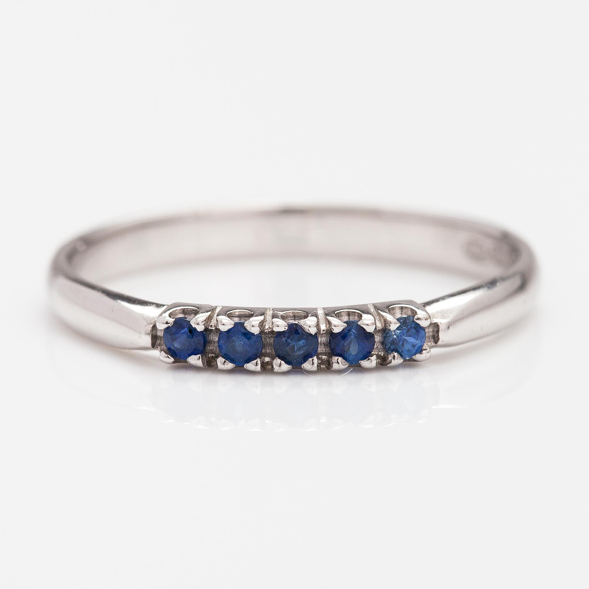A 14K white gold ring with sapphires.