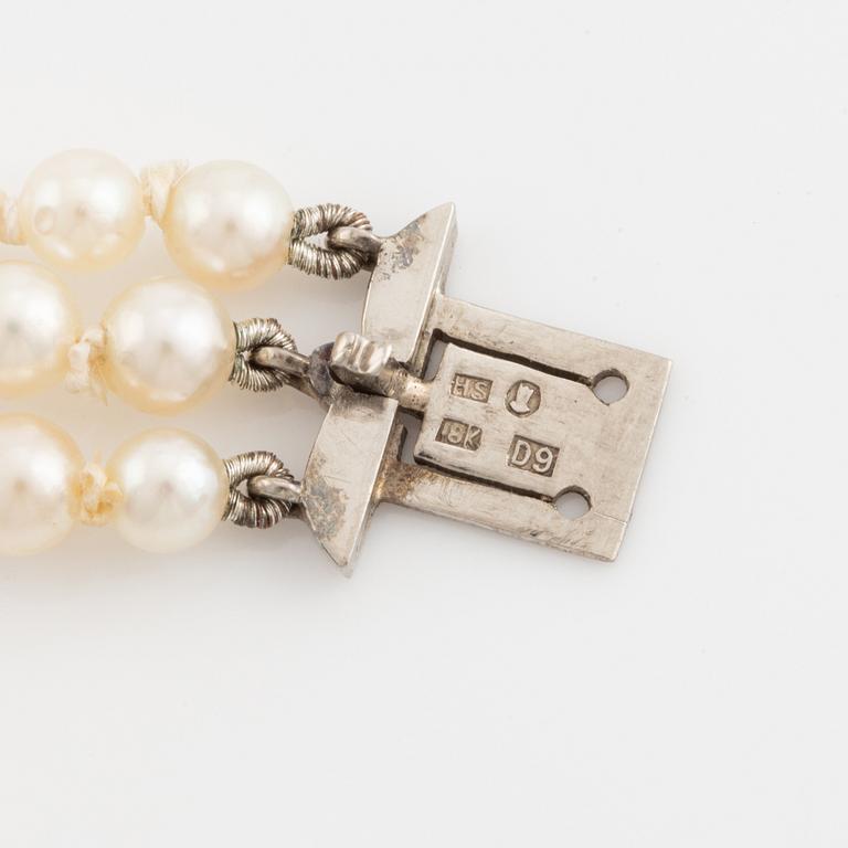 Three strand calibrated cultured pearl necklace, clasp with pearl and rose cut diamonds.