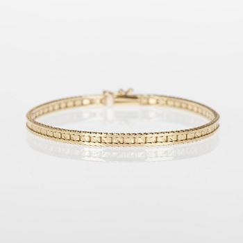 ARMRING och RING, 14/18K guld, briljantslipad diamant ca 0,15 ct. Vikt tot. 12,2 g.