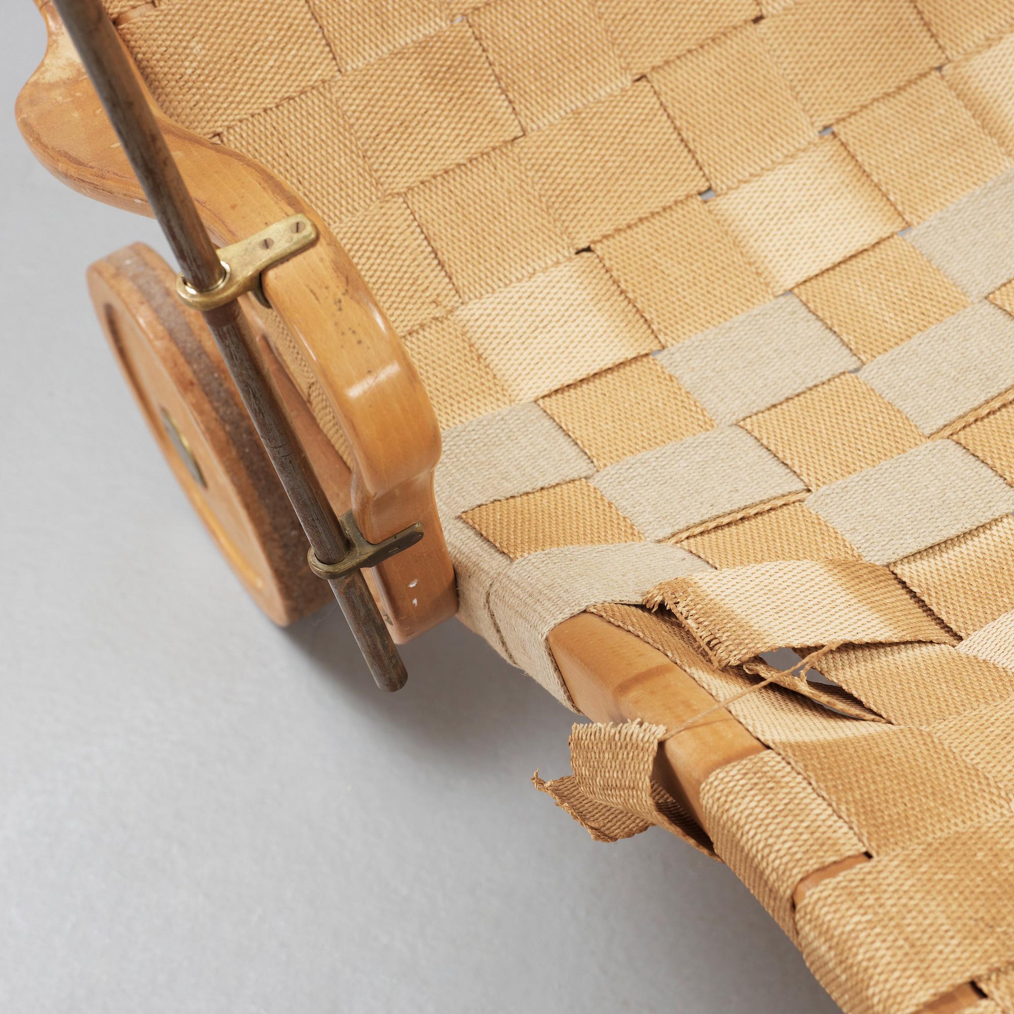 A Bruno Mathsson Swedish Modern chair with attached reading table, Karl Mathsson, Värnamo 1944.