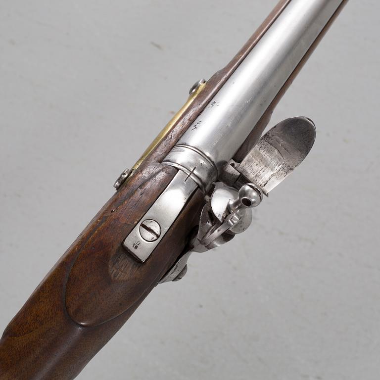 A flintlock rifle from Tower, England, around the year 1800.