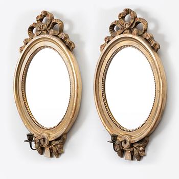A pair of Gustavian one-light girandole mirrors, 20th century.