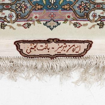 A Tabriz, carpet, 310 x 195 cm. signed.