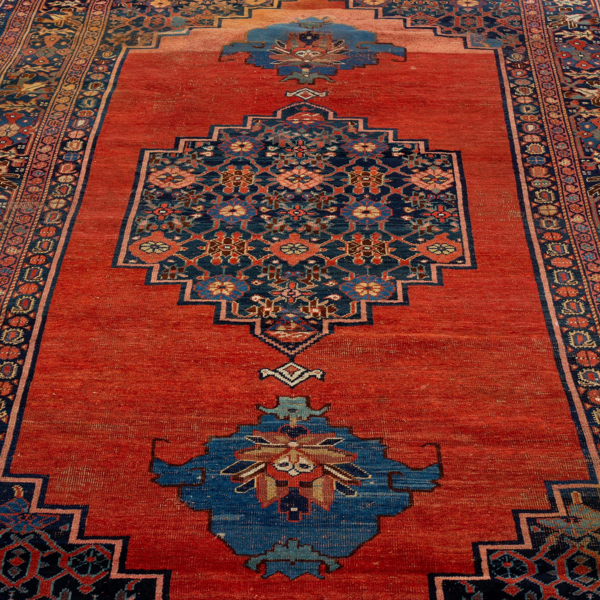 AN ANTIQUE BIDJAR CARPET, CA 374 X 224 CM.