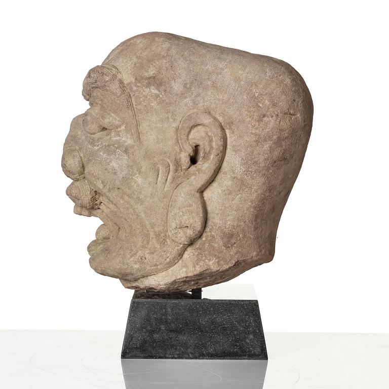 A sanstone sculpture of a Luohan, Yuanstyle.