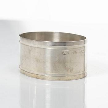 A pair of beakers, two napkin rings, and 17 pieces of cutlery, silver.