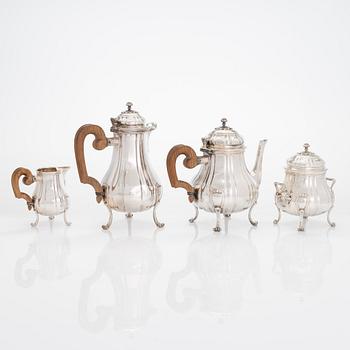 A French four-piece silver coffee and tea set, mark of Emile Puiforcat, Paris, first quarter of the 20th century.