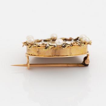 Brooch with miniature portrait on mother of pearl.