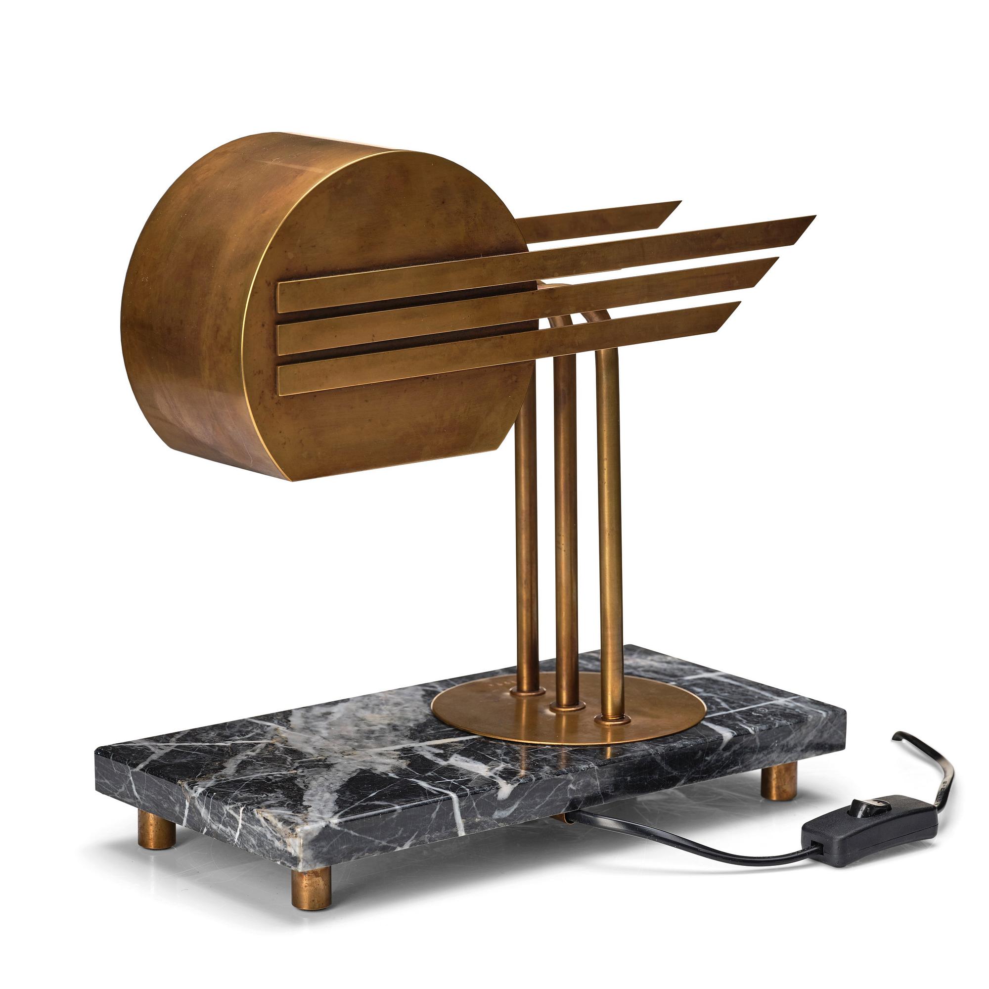 An Austrian brass and black marble table lamp, marked Vienna 1928.