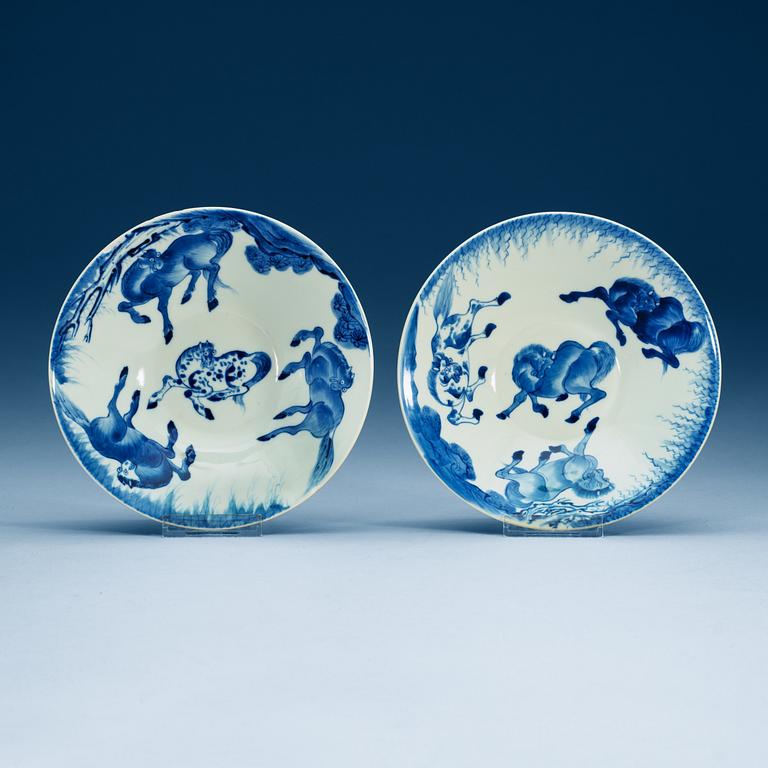 A pair of blue and white bowls with eight horses, Qing dynasty, 18th Century.