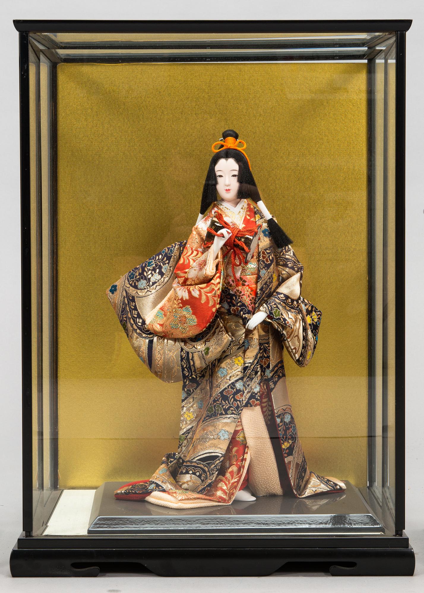 Four late 20th century Japanese dolls.