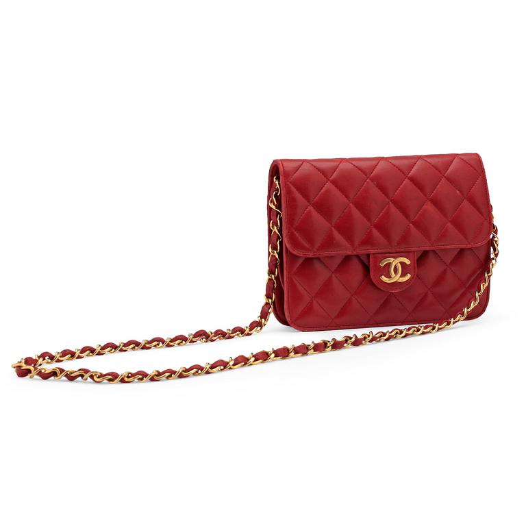 CHANEL, a red leather shoulder bag.