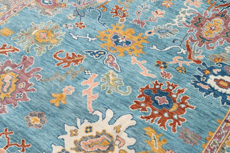 A Heriz design carpet, c. 301 x 240 cm.