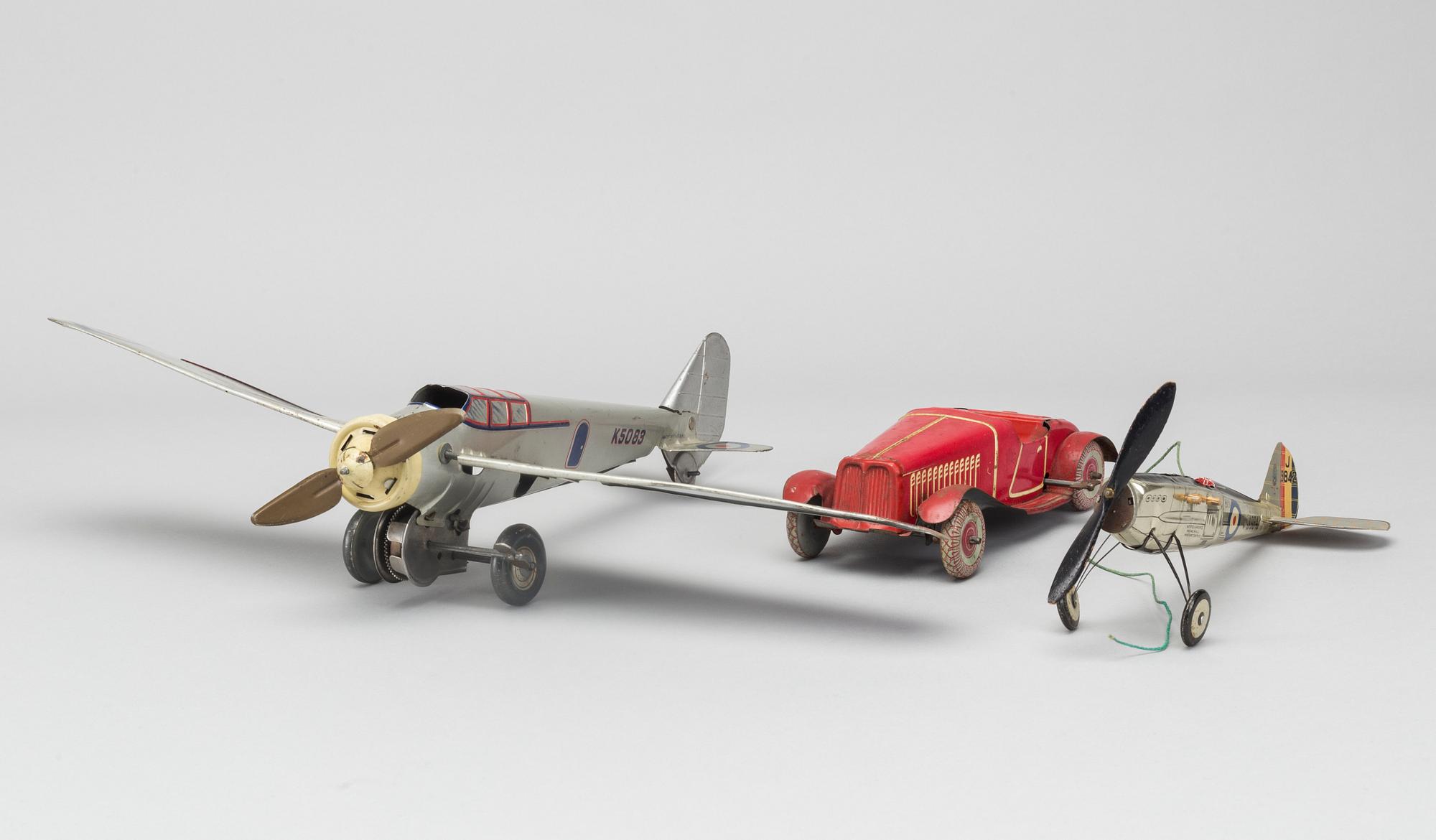 A COLLECTION OF MECHANICAL TIN TOYS, ONE  Frog Interceptor Fighter  Mark IV" England 1930'S.
