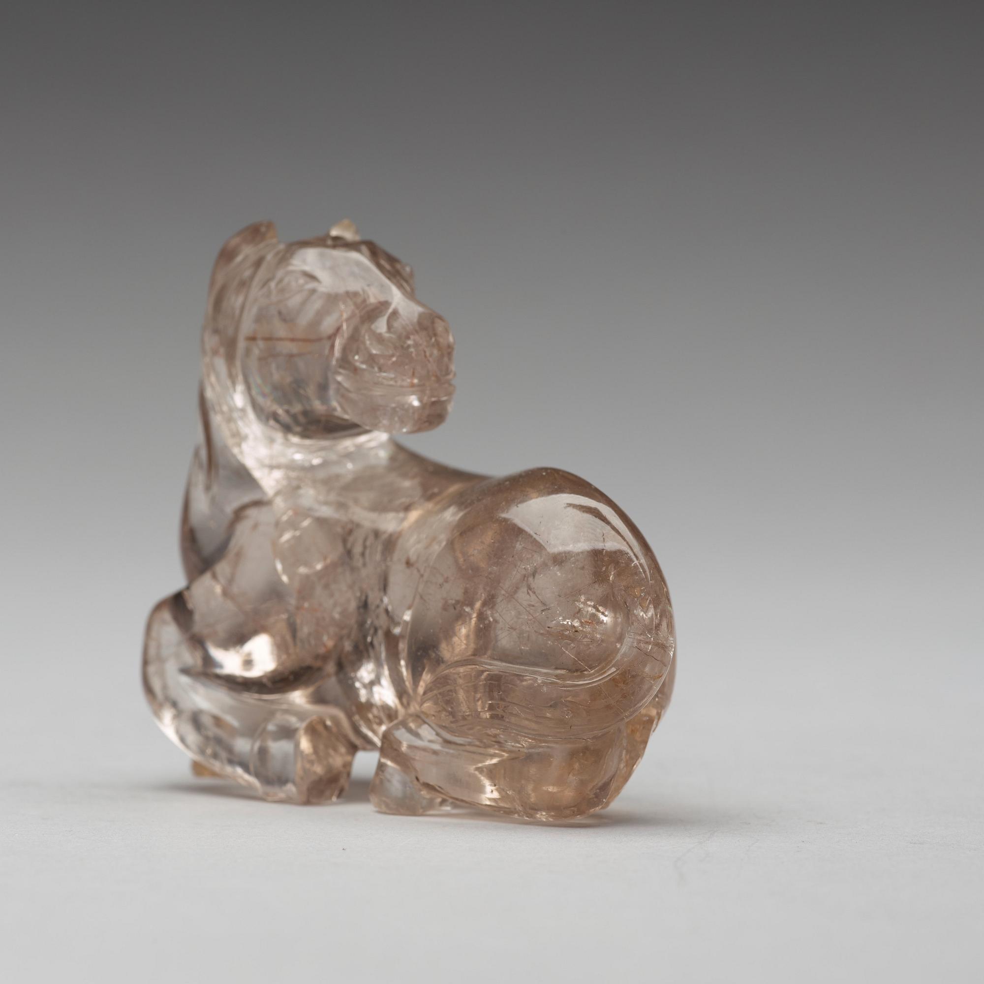 A quartz carving of a reclining horse, China.