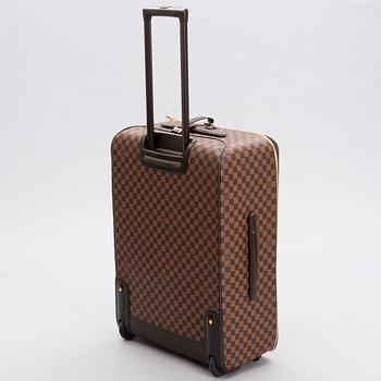LOUIS VUITTON Damier Ebene Brown Pégase Suitcase with protective cover.