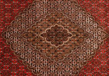 A carpet, Tabriz, part silk, 40-50 Radj, ca 300 x 195 cm.