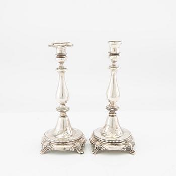 A 20th century set of two pairs of silver candle sticks different makers 1870/80s.