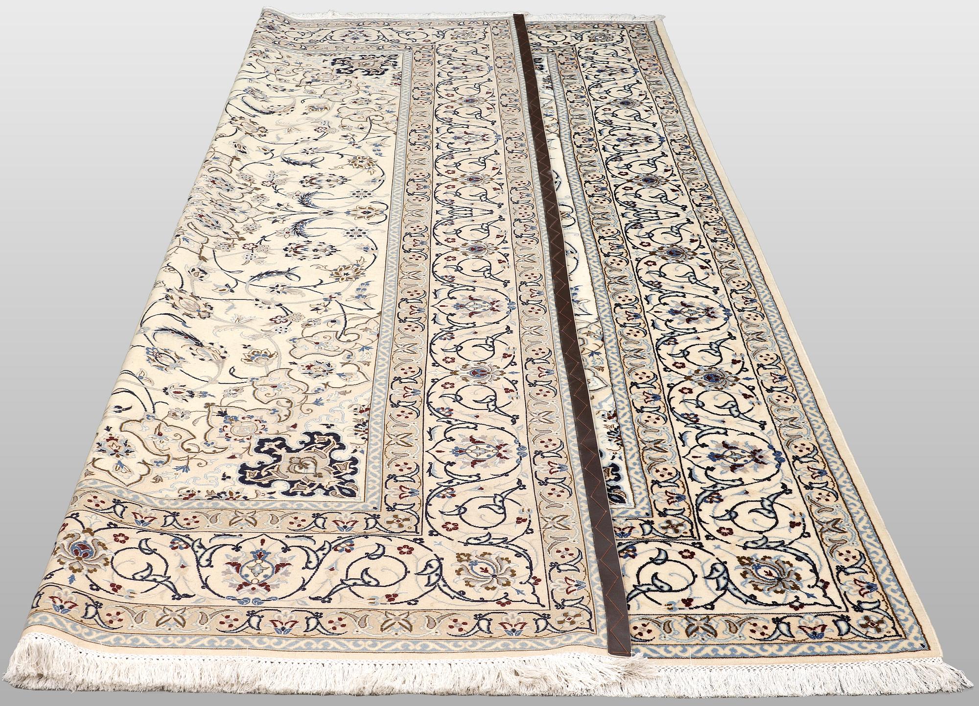 A Nain carpet, part silk, so-called 9 LAA, approx. 355 x 248 cm.