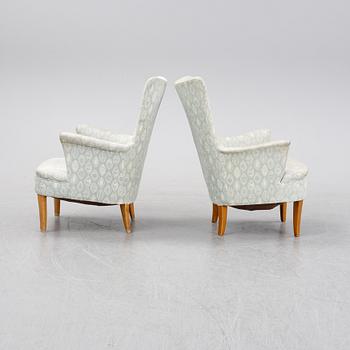 A pair of easy chairs by Carl Malmsten second half of the 20th Century.