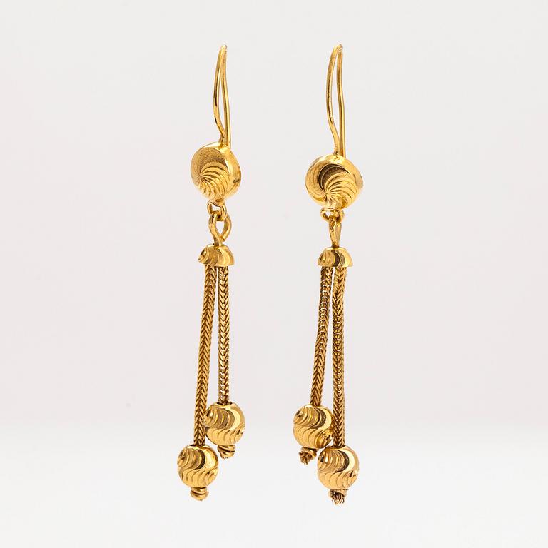 A pair of 21K gold earrings.