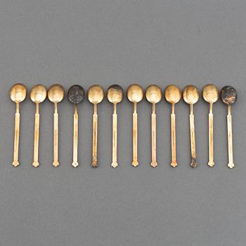 A mixed lot of 35 silver spoons, a tea strainer and two small dishes, parcel-gilt guilloché enamel, Norway, 20th century.