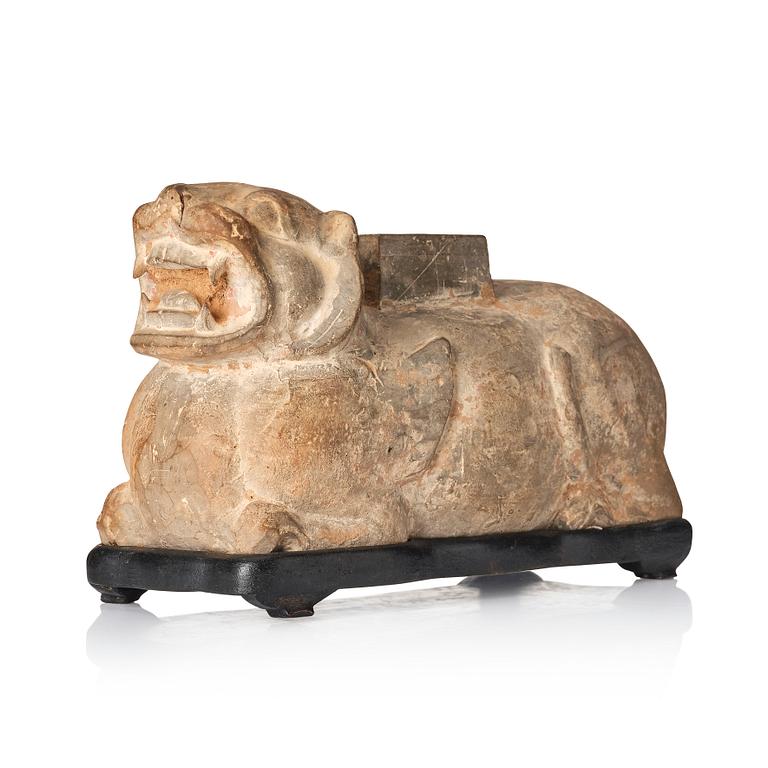 A pottery model of a recumant tiger/chimera, Han dynasty (206 BC-220 AD).