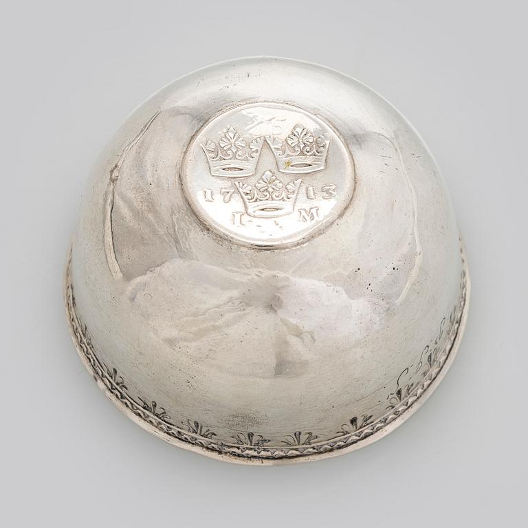 A silver tumbler with inset Swedish coin dated 1713.