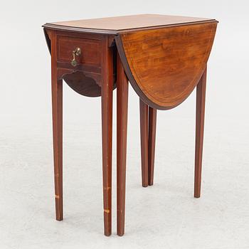 A drop-leaf table, England, early 20th Century.