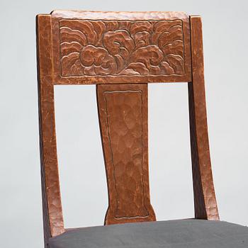 Otto Wretling, attributed to, an Art Nouveau pine 'partner's desk' with two chairs, Sweden, early 20th century.