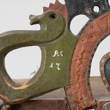 A Swedish carved and painted folk art shelf from Hälsingland, 18th / 19th century.