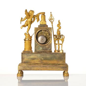 A French Empire ormolu figural mantel clock, early 19th century.