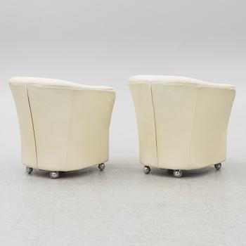A pair of leather armchairs, Dux, Sweden, 1980's.