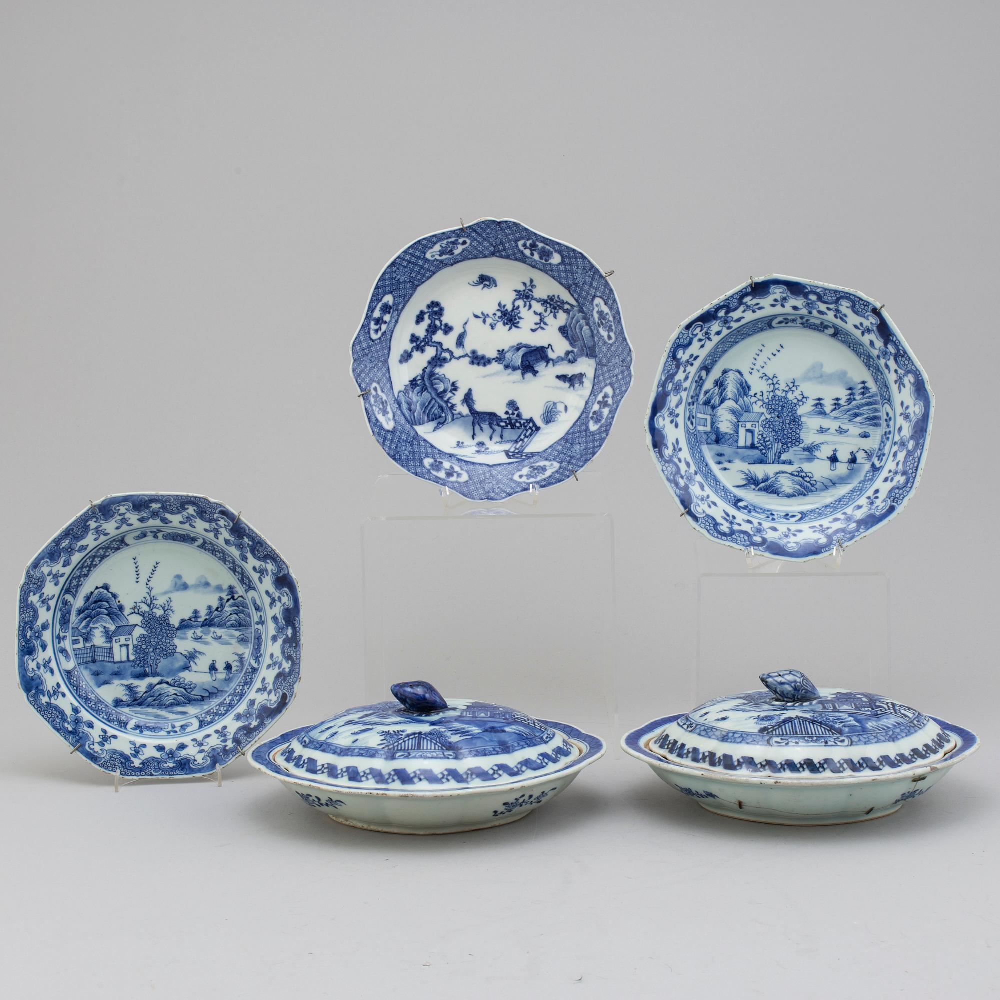 Two blue and white export porcelain tureens with covers and three dishes, Qing dynasty, 18th century.