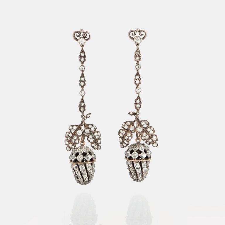 A pair of earrings set with old- and rose-cut diamonds.