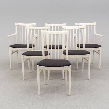 A dining table with six chairs by Carl Malmsten, Bodafors, 1960s.