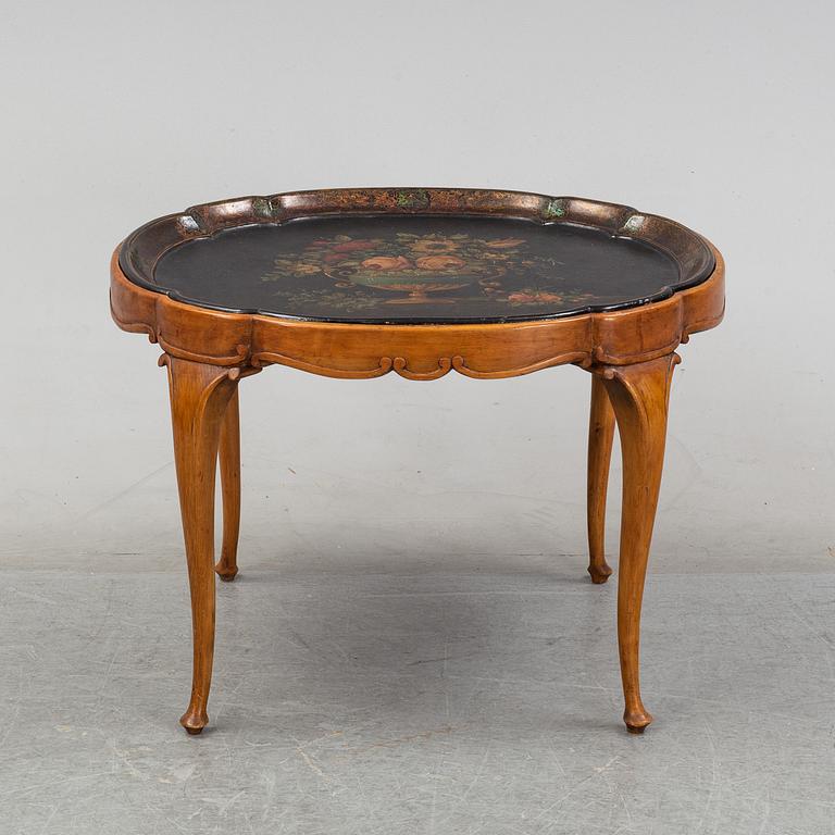 A rococo style side table with a loose tray.