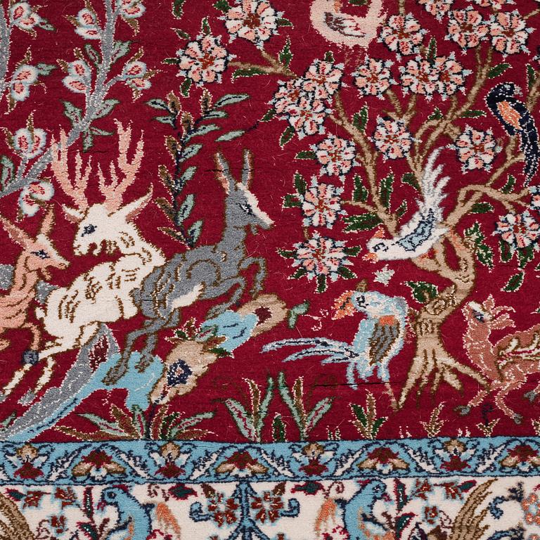 A Isfahan rug, possible, part silk, 122 x 83 cm.