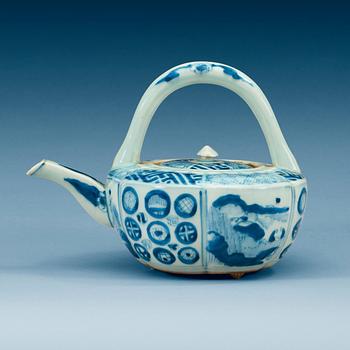 A blue and white Japanese tea pot with cover.