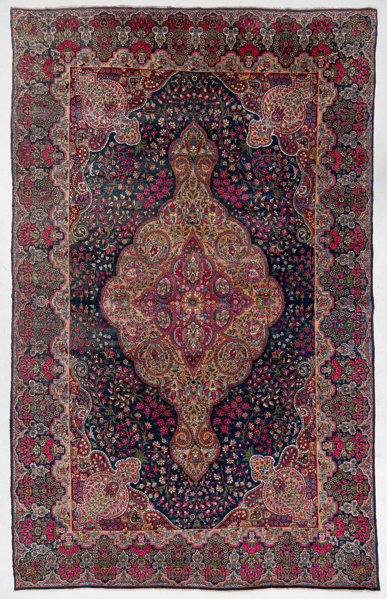 A semi-antique Kirman carpet, south Persia, c. 440 x 279 cm.