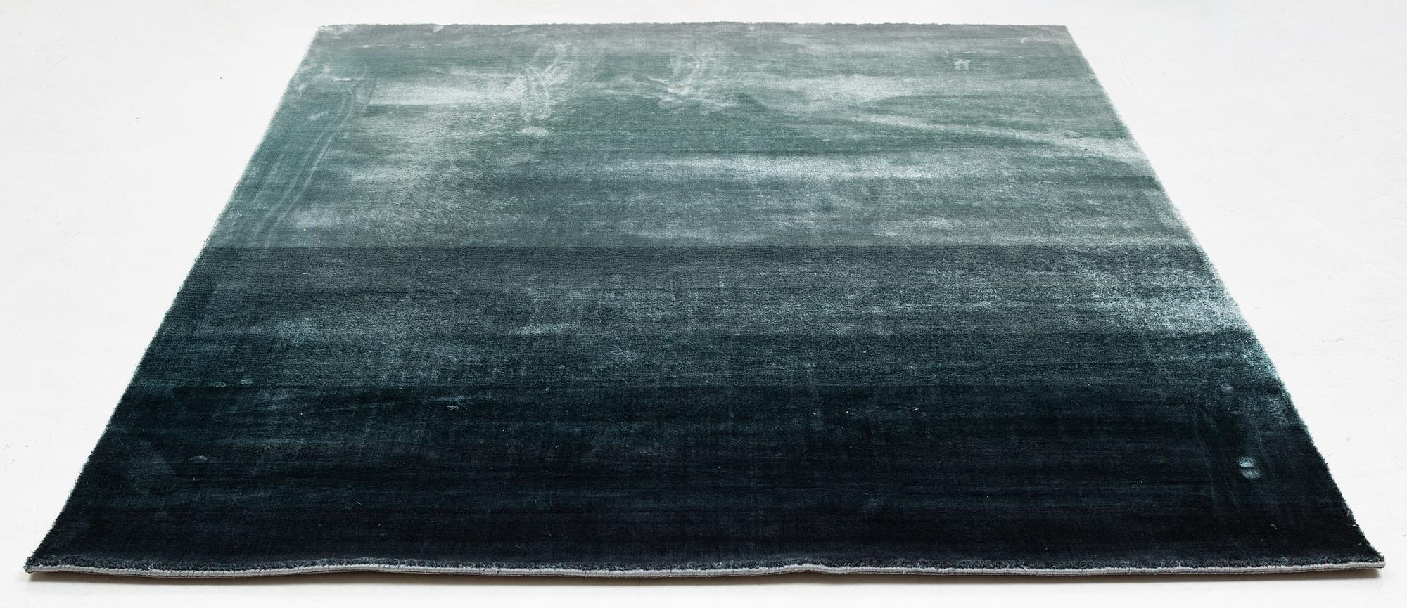 A Designers Guild carpet 'Capisoli teal', ca 205 x 300 cm.