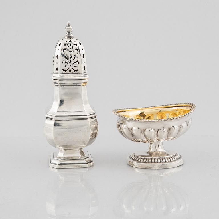 A silver sugar caster from E. S. Barnsley & Co, Birmingham,  1914, and a silver salt cellar with indistinct marks.