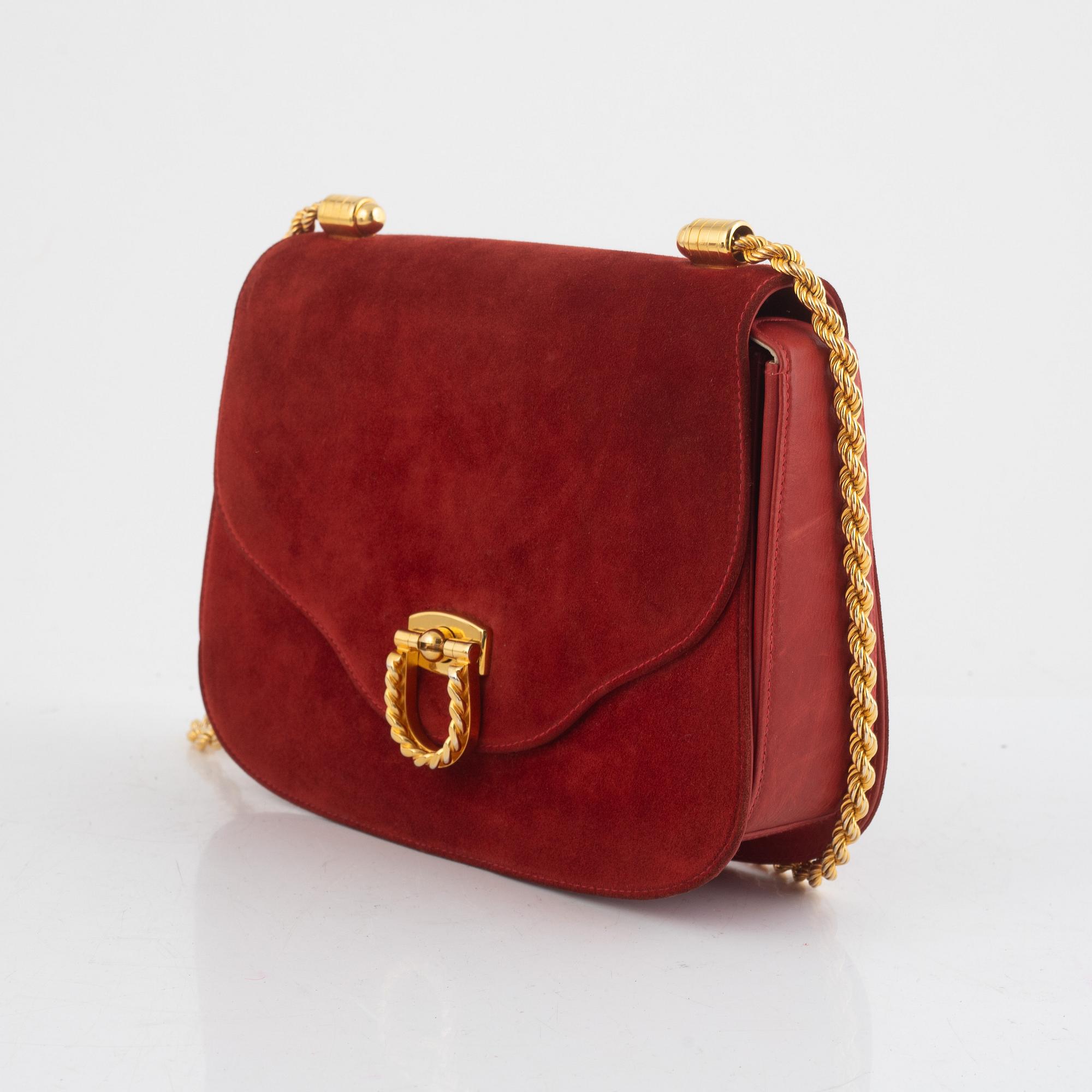 Gucci, a vintage suede bag.